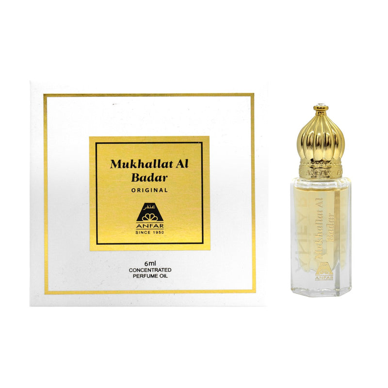A product image featuring a small, clear bottle with a golden cap, labeled 'Mukhallat Al Badar Original'. Accompanied by a white box with gold accents.