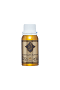 A bottle of Mukhallat Al Badar perfume with a beige label and a white cap.